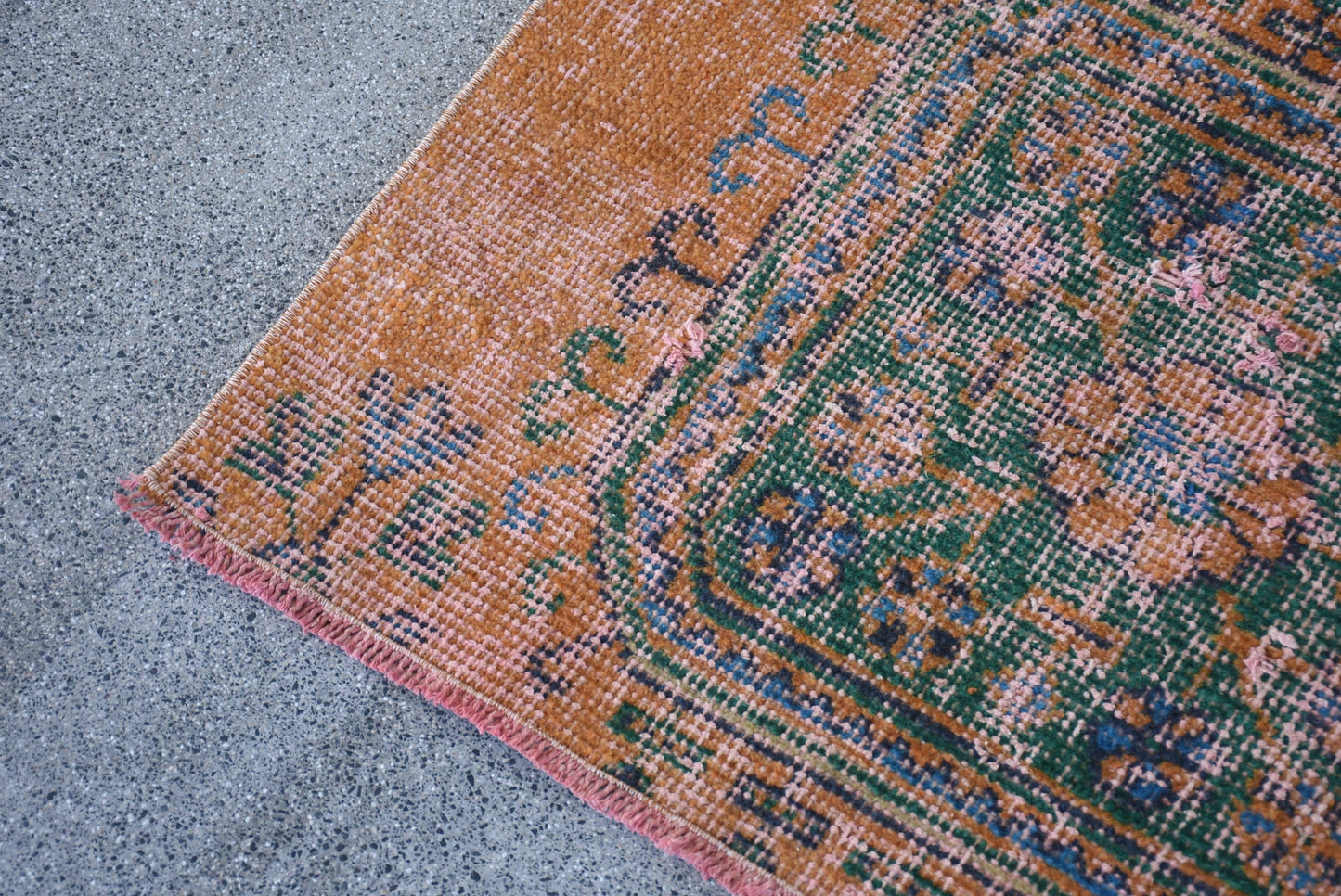 Vintage Orange Wool Rug: Geometric & Floral Design