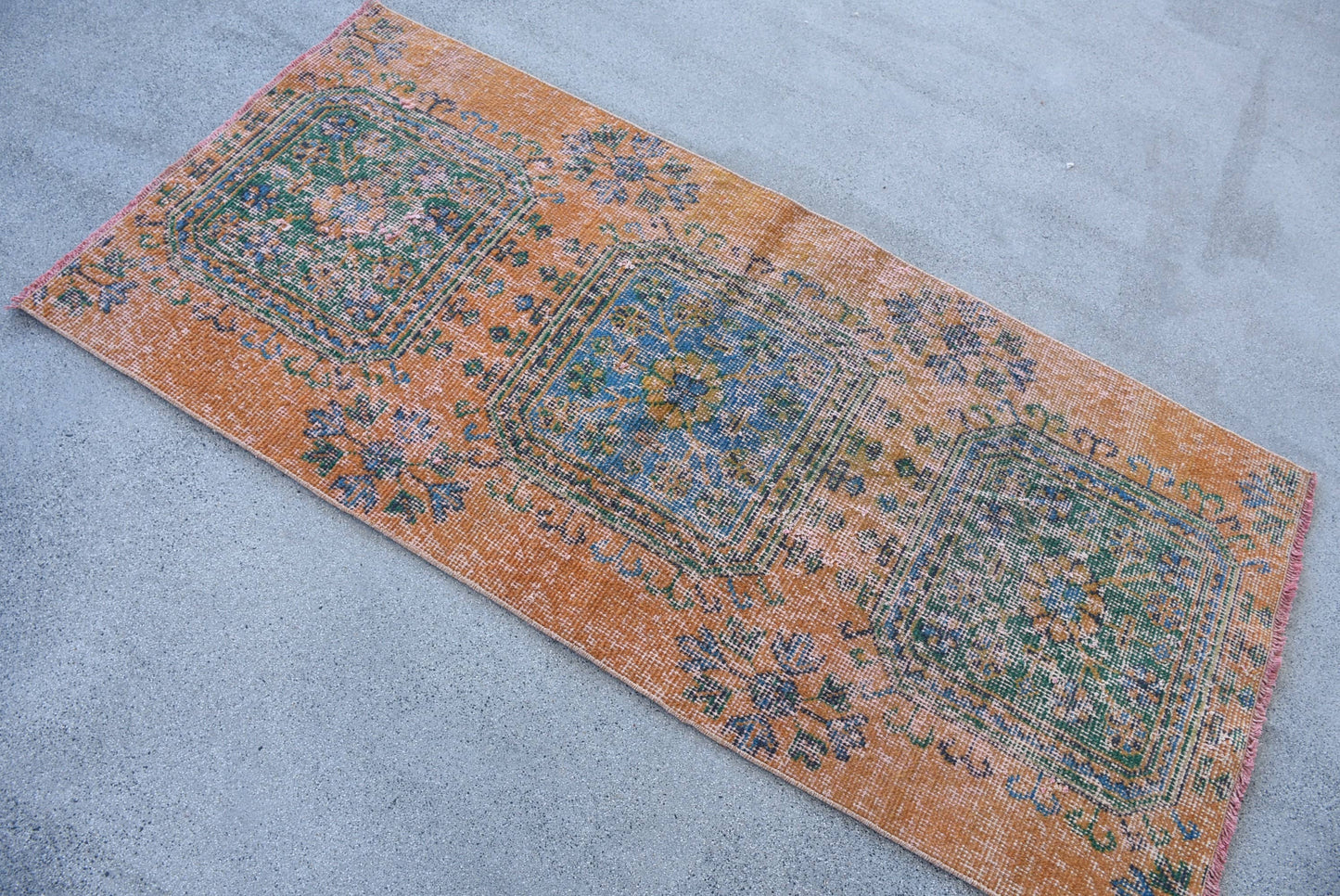 Vintage Orange Wool Rug: Geometric & Floral Design