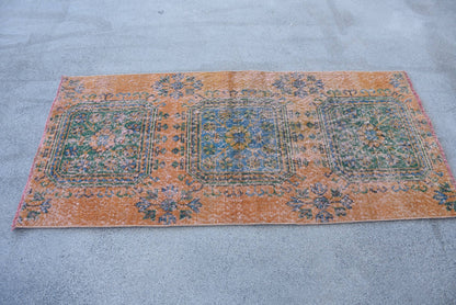 Vintage Orange Wool Rug: Geometric & Floral Design