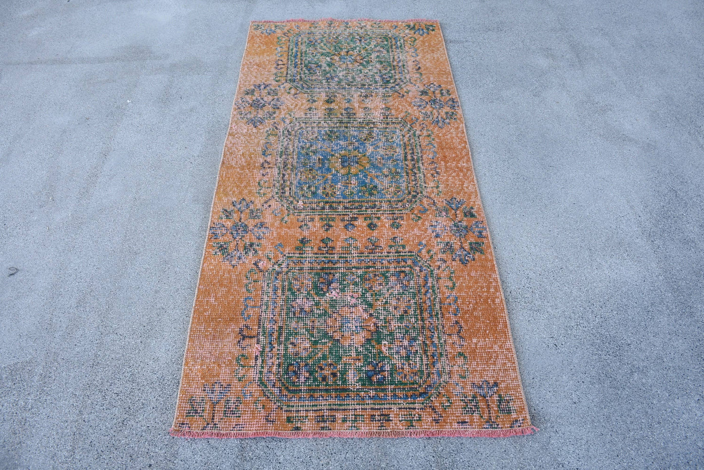 Vintage Orange Wool Rug: Geometric & Floral Design