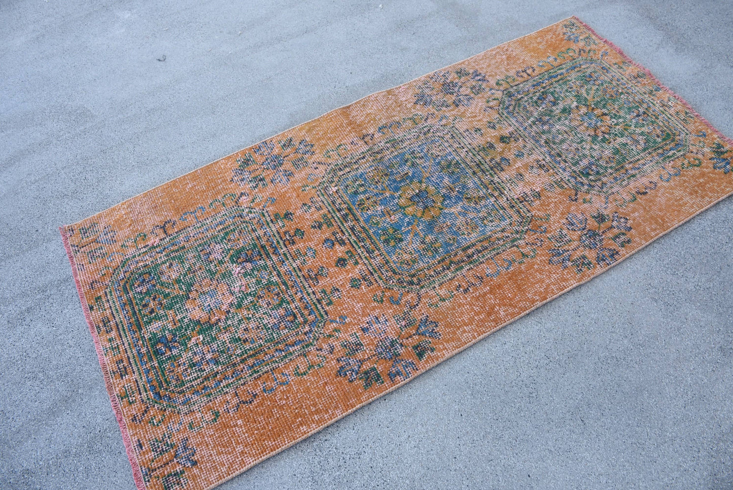 Vintage Orange Wool Rug: Geometric & Floral Design